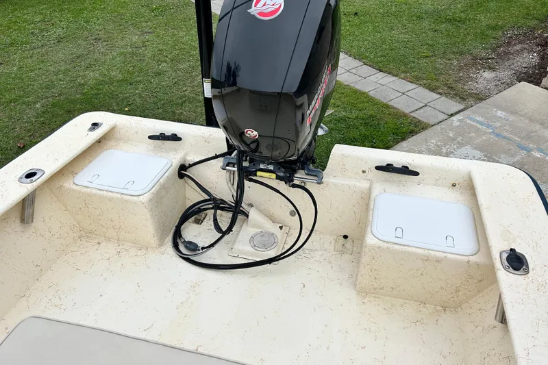 Slide: The Image of 2000 Jones Brothers 22 Bateau boat with outboard motor, viewed from the stern. - 12