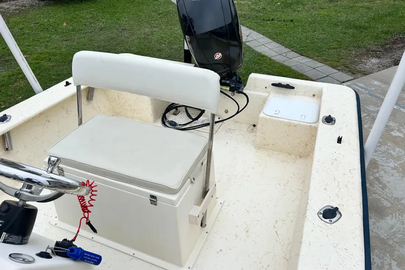 Slide: The Image of Jones Brothers 22 Bateau boat interior, featuring steering console and seating, year 2000 model. - 15