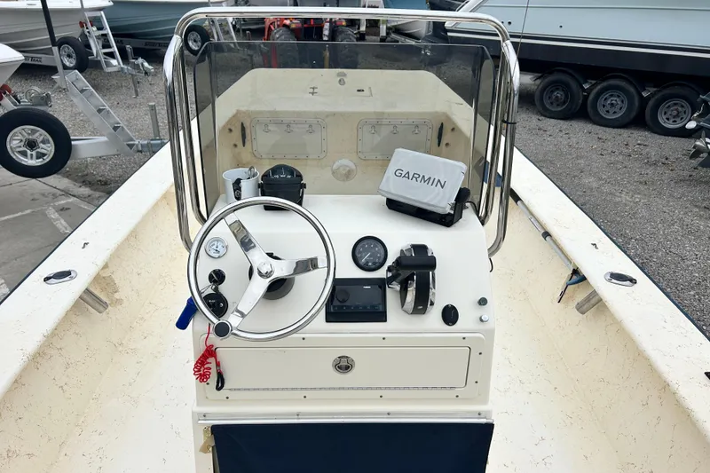 Slide: The Image of Jones Brothers 22 Bateau 2000 boat console with Garmin navigation system and steering wheel. - 17