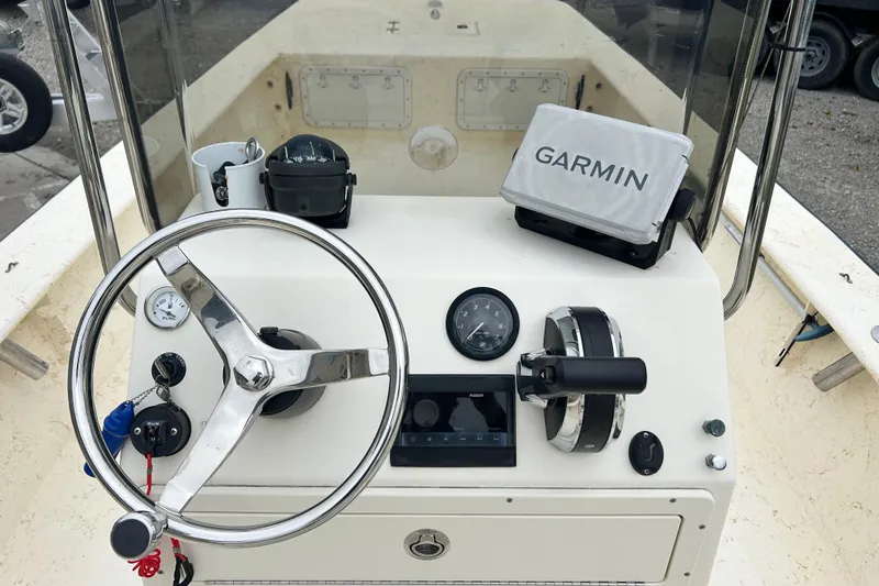 Slide: The Image of Center console of a 2000 Jones Brothers 22 Bateau boat with Garmin navigation system. - 18