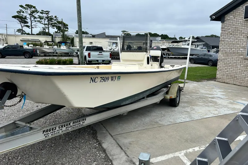 Slide: The Image of 2000 Jones Brothers 22 Bateau boat on trailer, parked at marine dealership. - 2
