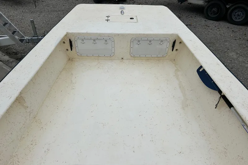 Slide: The Image of 2000 Jones Brothers 22 Bateau boat interior with storage compartments. - 20