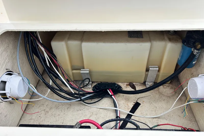 Slide: The Image of Electrical wiring and components inside a 2000 Jones Brothers 22 Bateau boat compartment. - 22