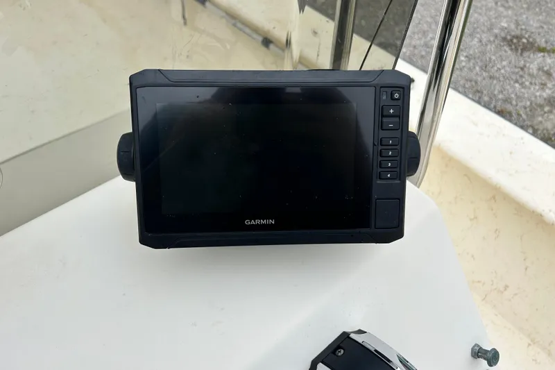 Slide: The Image of Garmin GPS device on 2000 Jones Brothers 22 Bateau boat dashboard. - 23