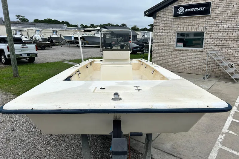 Slide: The Image of 2000 Jones Brothers 22 Bateau boat on trailer near Mercury dealership. - 8