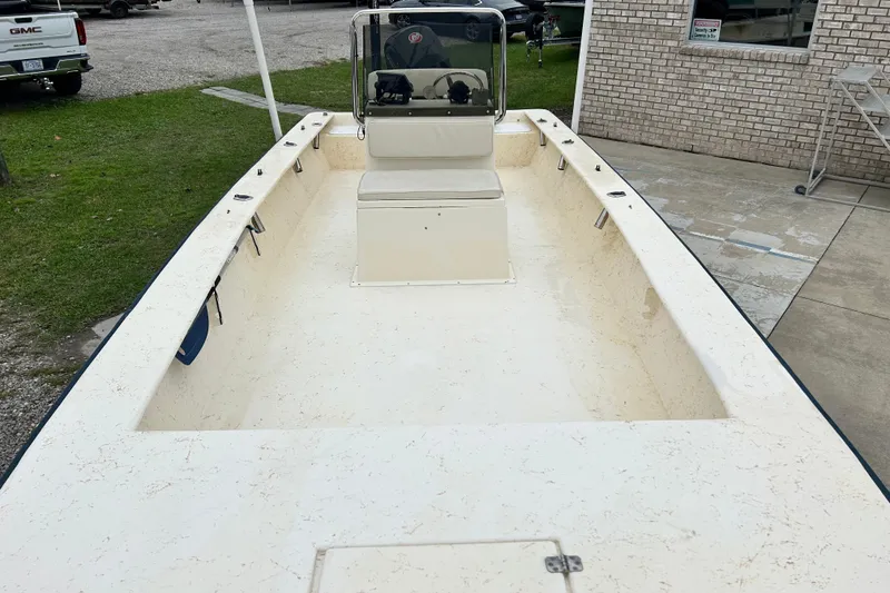 Slide: The Image of 2000 Jones Brothers 22 Bateau boat with center console, parked on concrete. - 9
