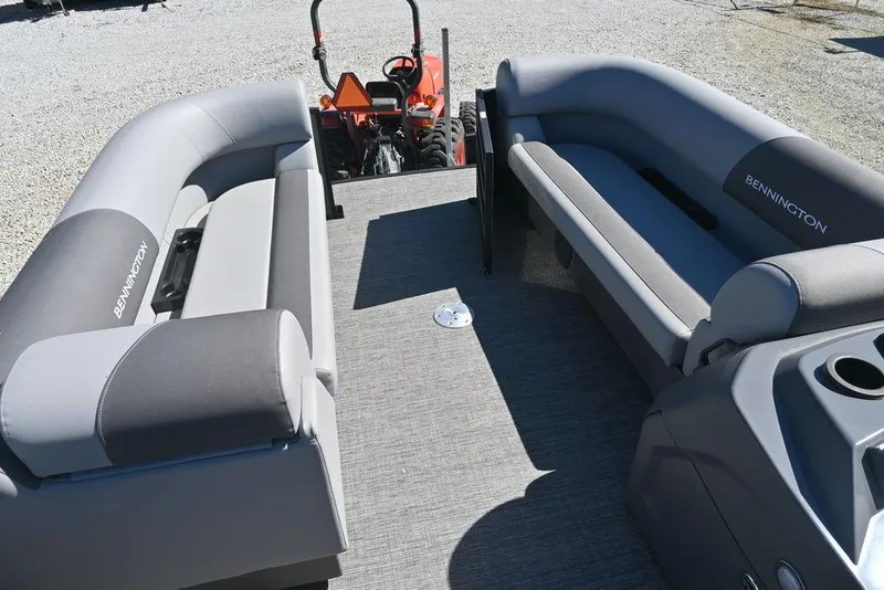 Slide: The Image of 2025 Bennington S 20 SSR pontoon boat interior with gray seating and flooring. - 12