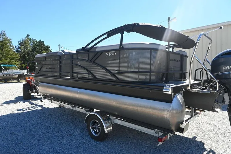 Slide: The Image of 2025 Bennington S 20 SSR pontoon boat on trailer, outdoor setting. - 6