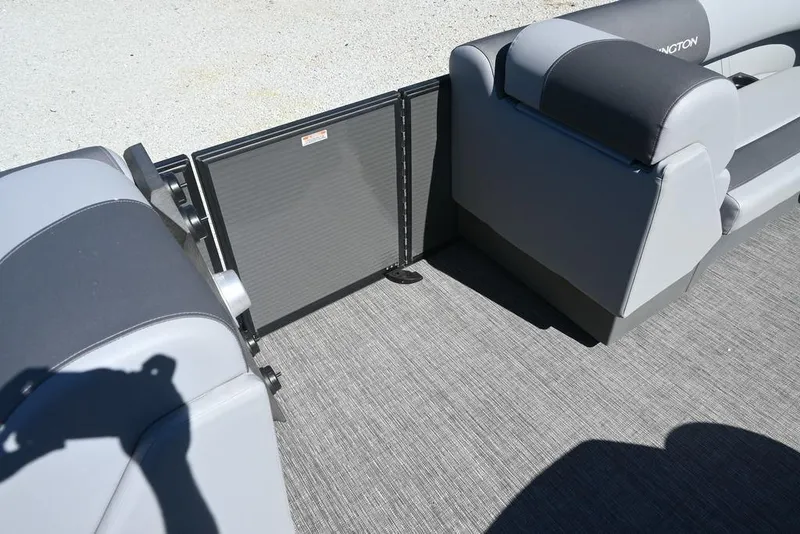 Slide: The Image of 2025 Bennington S 20 SSR pontoon boat interior with gray seating and flooring. - 9