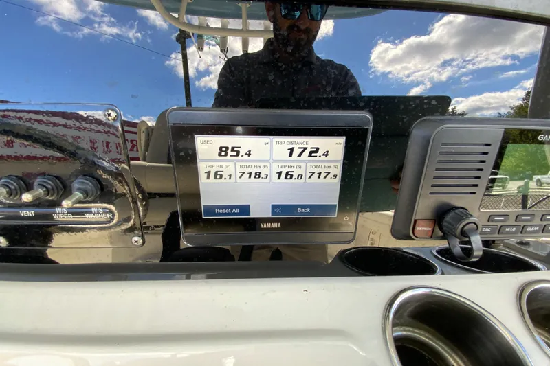 Slide: The Image of Cobia 280 Center Console 2021 dashboard with Yamaha display showing trip data. - 31