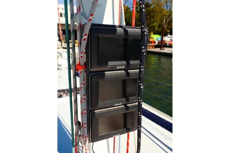 Slide: The Image of B&G marine displays on a 2002 J Boats J/46 sailboat mast with colorful ropes. - 10