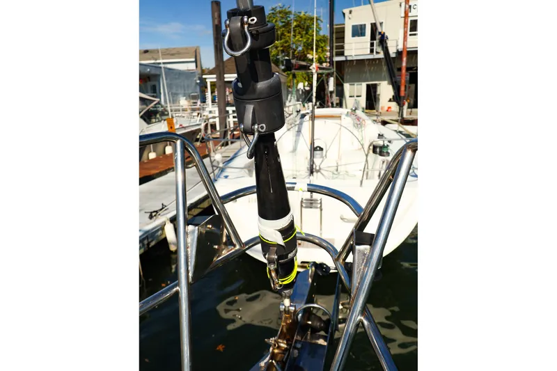 Slide: The Image of Bow view of a 2002 J Boats J/46 sailboat docked at a marina. - 13