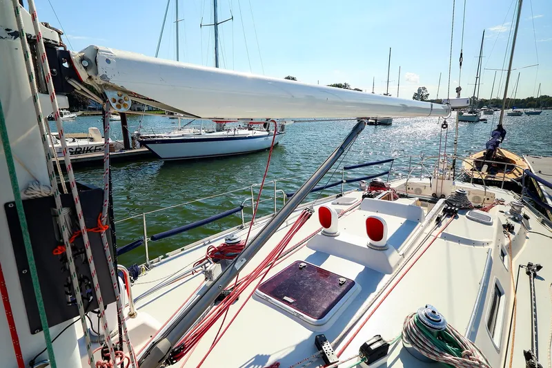 Slide: The Image of 2002 J Boats J/46 sailboat docked, showcasing deck and rigging details. - 2