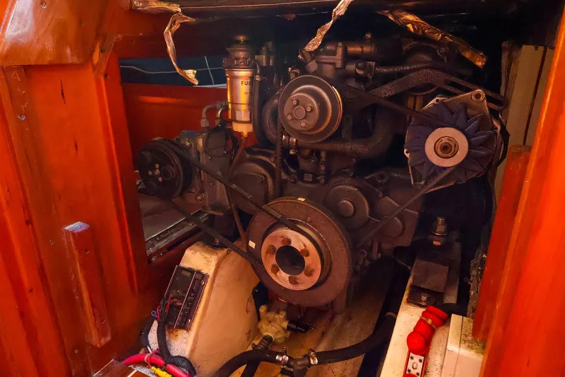 Slide: The Image of Engine compartment of a 2002 J Boats J/46 sailboat, showcasing mechanical components. - 35