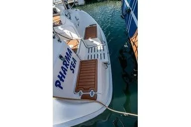Slide: The Image of Hunter 356 sailboat, 2003 model, docked with "PHARMA SEA" on the stern. - 10
