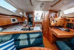 Slide: The Image of Interior of 2003 Hunter 356 sailboat with wood finish and modern amenities. - 13