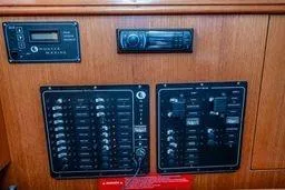 Slide: The Image of Control panel of a 2003 Hunter 356 sailboat with electronic displays and switches. - 26