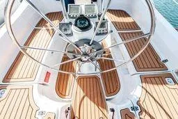 Slide: The Image of Steering wheel and controls on a 2003 Hunter 356 sailboat deck. - 6