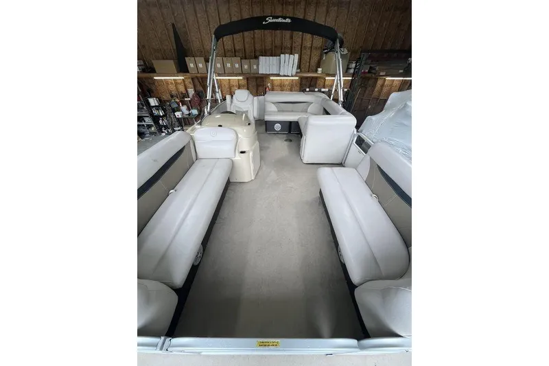 Slide: The Image of Interior of a 2016 Godfrey 2086 pontoon boat with beige seating and canopy. - 19