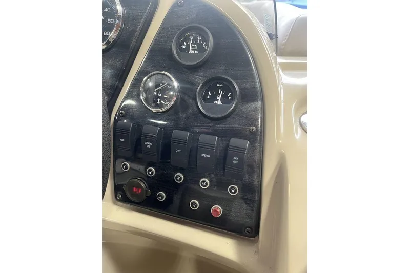 Slide: The Image of Dashboard of a 2016 Godfrey 2086 boat with gauges and switches. - 21