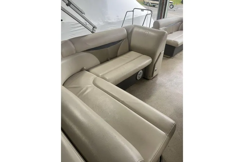 Slide: The Image of Beige seating in a 2016 Godfrey 2086 boat interior, showcasing comfort and style. - 28