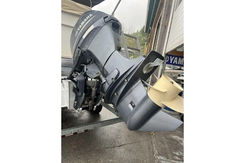 Slide: The Image of Outboard motor on a 2016 Godfrey 2086 boat, featuring a Yamaha engine. - 8
