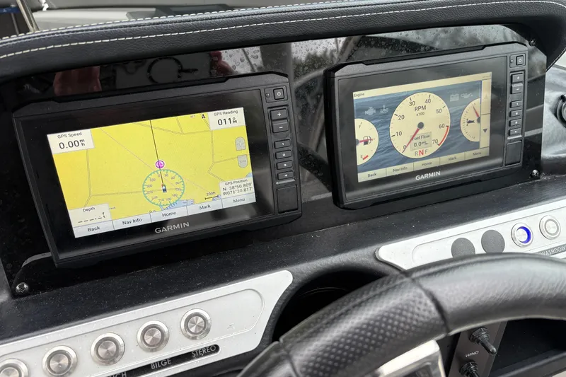 Slide: The Image of Dashboard of 2022 Crownline Eclipse E285 XS with Garmin navigation displays. - 3