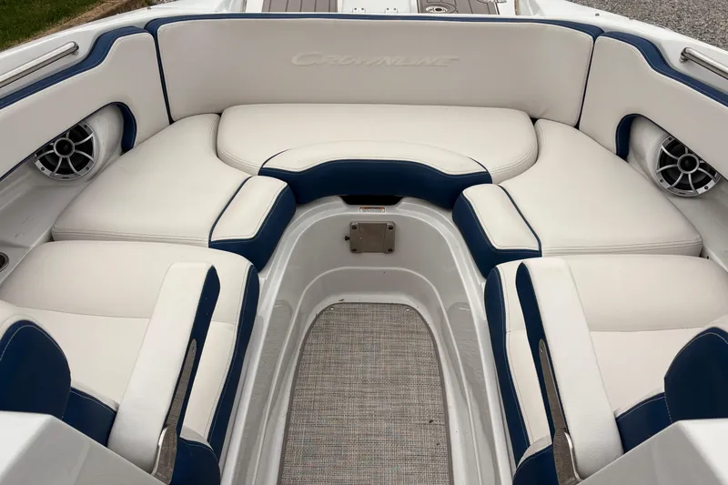 Slide: The Image of 2022 Crownline Eclipse E285 XS boat interior with white and blue seating. - 8
