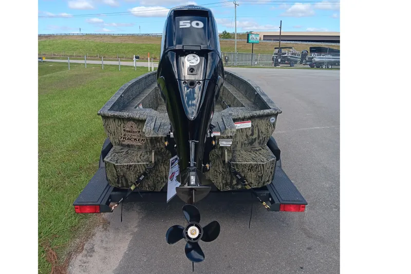 Slide: The Image of 2026 Tracker Grizzly 1650 T Prairie Wings Edition boat with camo design and outboard motor. - 3