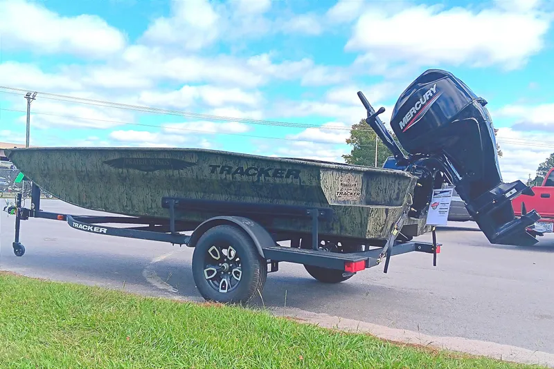 Slide: The Image of 2026 Tracker Grizzly 1650 T Prairie Wings Edition boat on trailer, outdoors. - 4