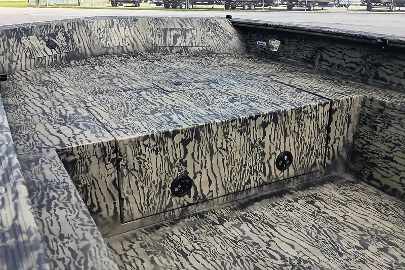 Slide: The Image of 2026 Tracker Grizzly 1650 T Prairie Wings Edition boat interior with camouflage design. - 8