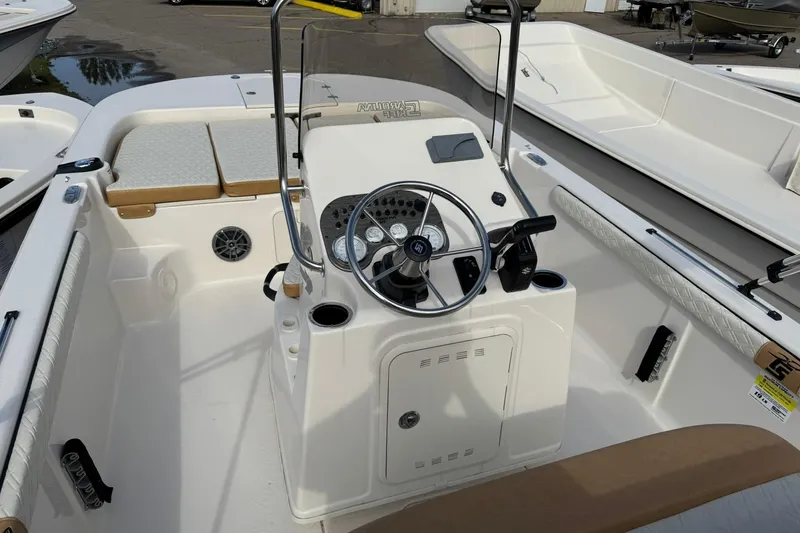 Slide: The Image of 2026 Carolina Skiff 19 LS boat interior with steering console and seating. - 10