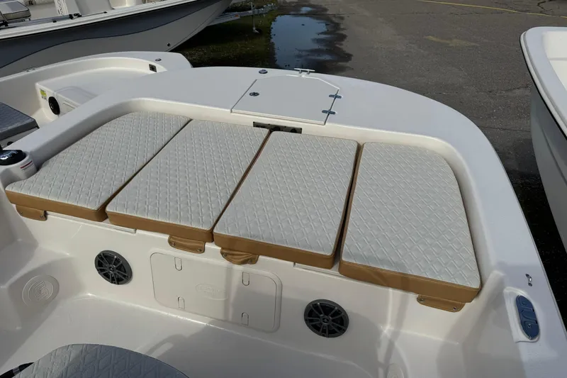 Slide: The Image of 2026 Carolina Skiff 19 LS boat interior with cushioned seating and storage compartments. - 15