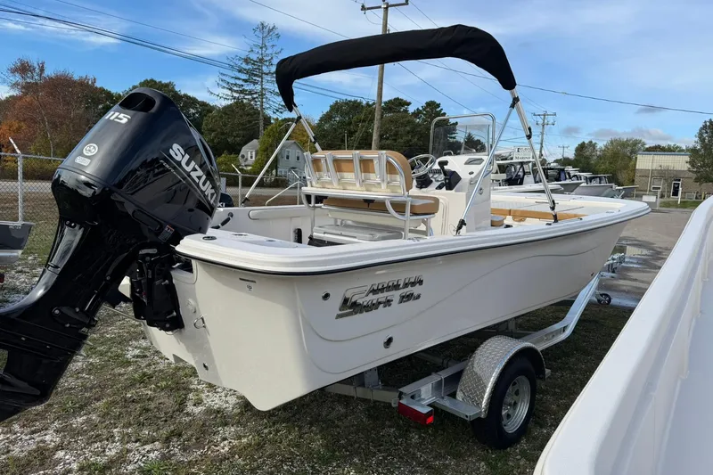 Slide: The Image of 2026 Carolina Skiff 19 LS boat with Suzuki outboard motor on trailer. - 5