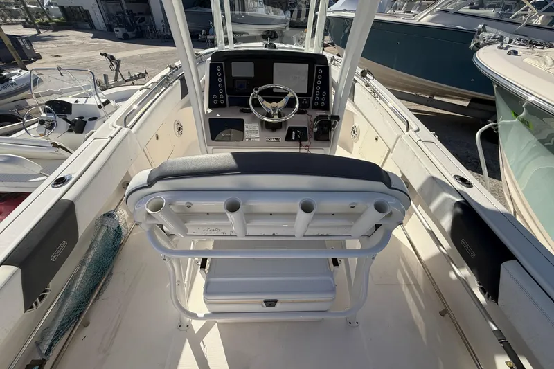 Slide: The Image of 2019 Robalo R242 Center Console boat interior with helm and seating. - 13