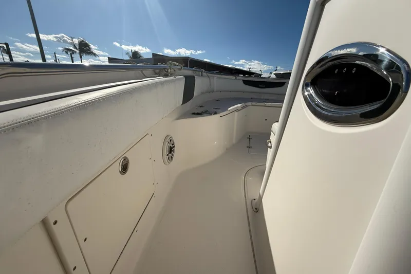 Slide: The Image of 2019 Robalo R242 Center Console boat interior with seating and storage compartments. - 14