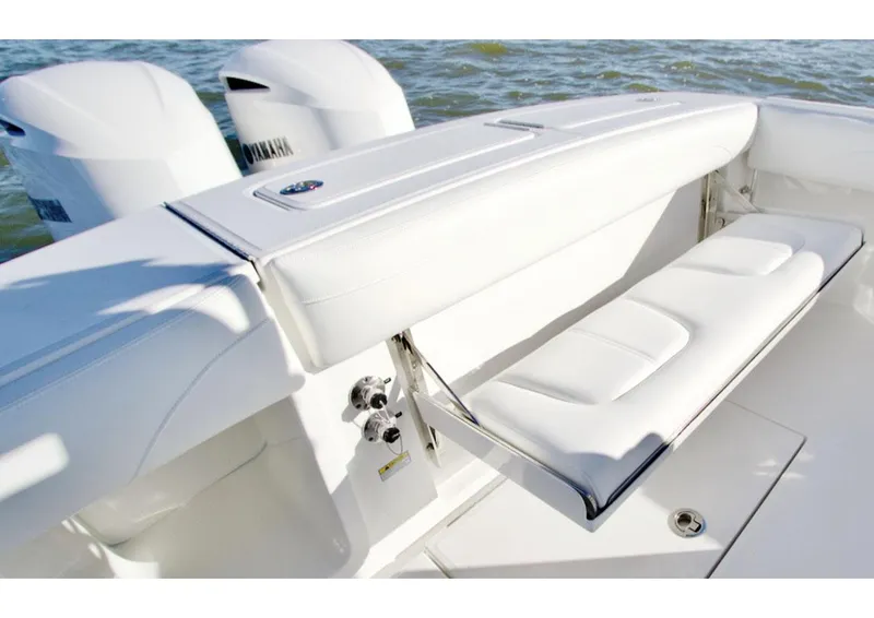 Slide: The Image of 2026 Regulator 25 boat interior with rod holders and storage compartments. - 7