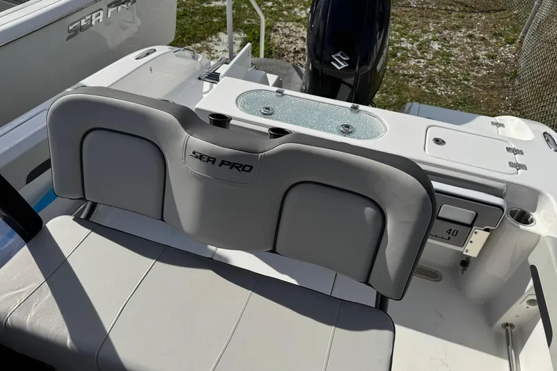 Slide: The Image of 2025 Sea Pro 222 Center Console boat dashboard with steering wheel and navigation controls. - 12
