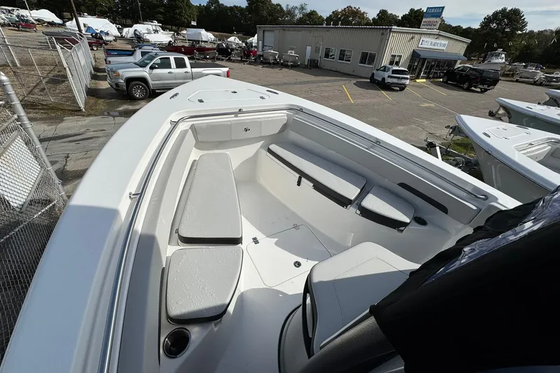 Slide: The Image of 2025 Sea Pro 222 Center Console dashboard with controls, cup holders, and audio system. - 15