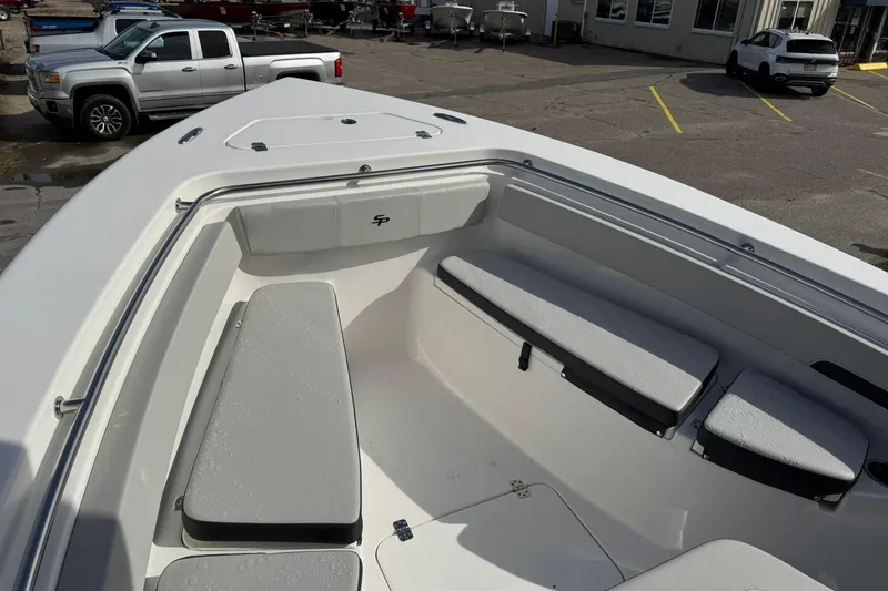 Slide: The Image of 2025 Sea Pro 222 Center Console boat interior with seating and motor. - 16