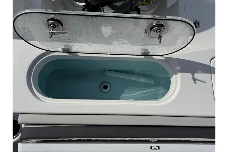 Slide: The Image of 2025 Sea Pro 222 Center Console boat with Suzuki engine and cushioned seating. - 18