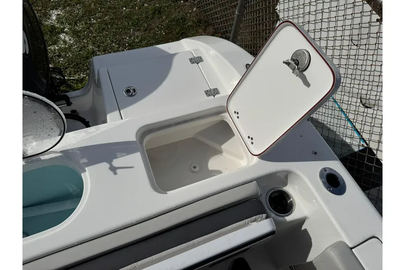 Slide: The Image of 2025 Sea Pro 222 Center Console boat at a marine store, showcasing sleek design and modern features. - 19