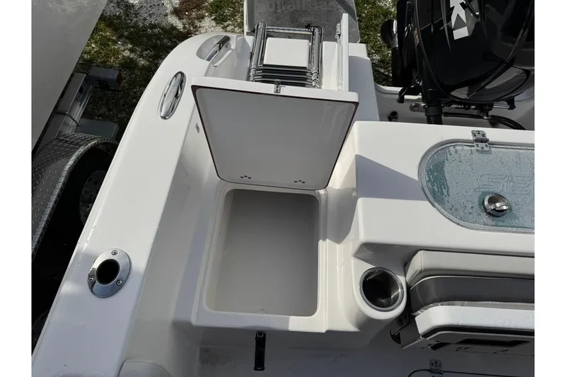 Slide: The Image of 2025 Sea Pro 222 Center Console boat on trailer, parked outdoors. - 21