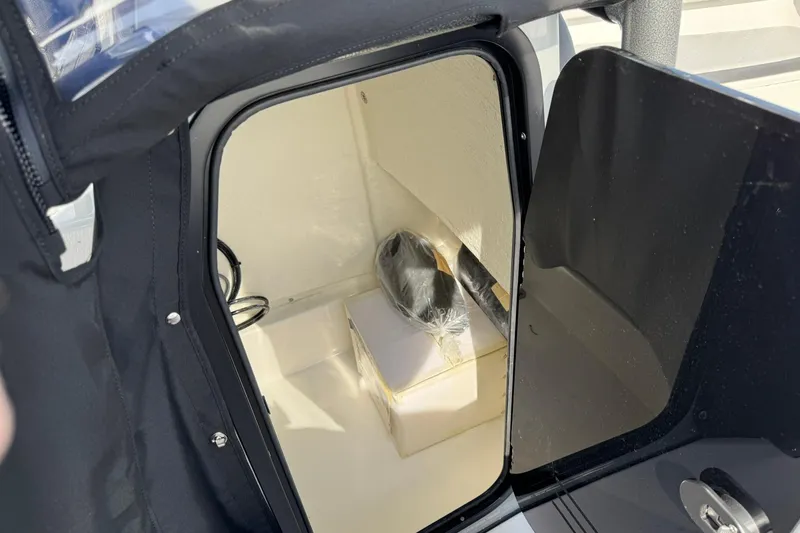 Slide: The Image of 2025 Sea Pro 222 Center Console livewell with open lid, showcasing interior design. - 23