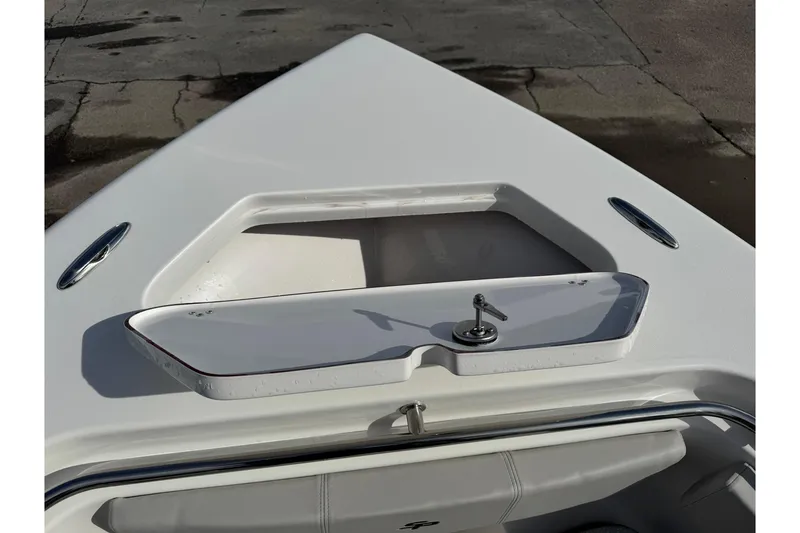 Slide: The Image of 2025 Sea Pro 222 Center Console boat bow with storage compartment and sleek design. - 26