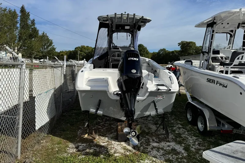 Slide: The Image of 2025 Sea Pro 222 Center Console boats displayed at a marine store lot. - 4