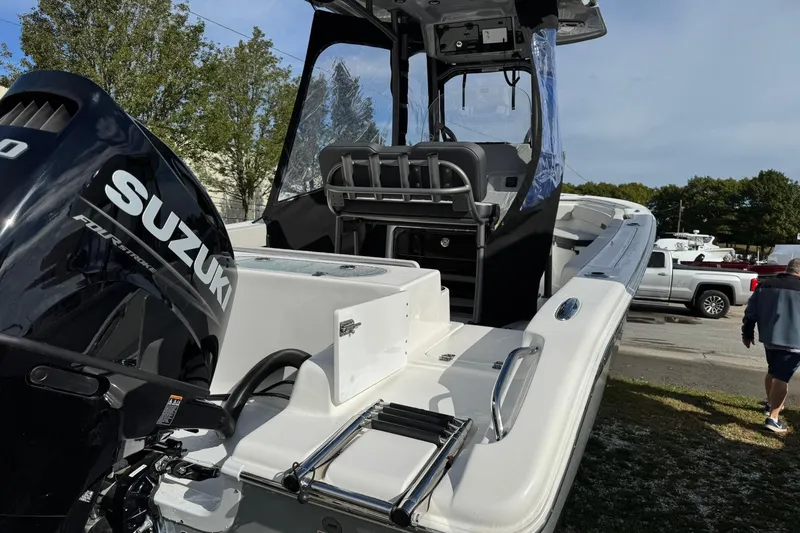 Slide: The Image of 2025 Sea Pro 222 Center Console boat with Suzuki 200 engine, parked outdoors. - 7