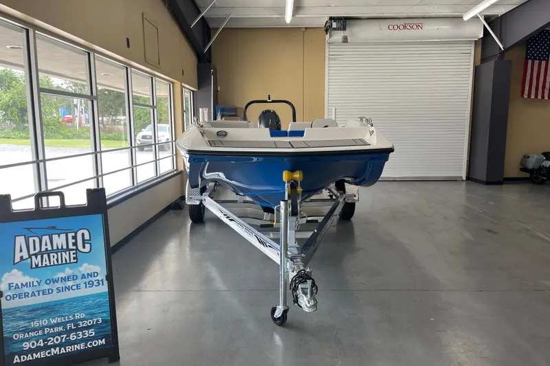 The Image of 2026 Starcraft SV 16 OB boat displayed indoors at Adamec Marine showroom. - 1