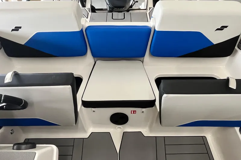 Slide: The Image of 2026 Starcraft SV 16 OB boat interior with blue and white seating. - 13