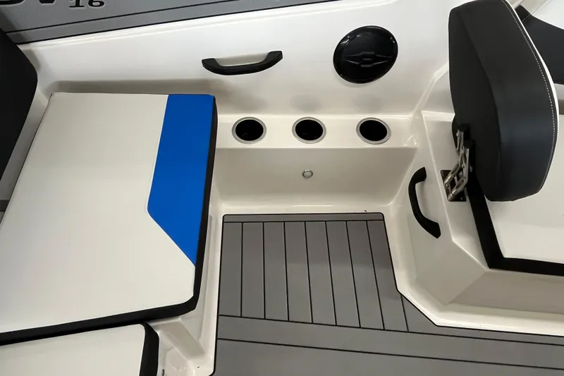 Slide: The Image of 2026 Starcraft SV 16 OB boat interior with seating, cup holders, and speaker. - 16